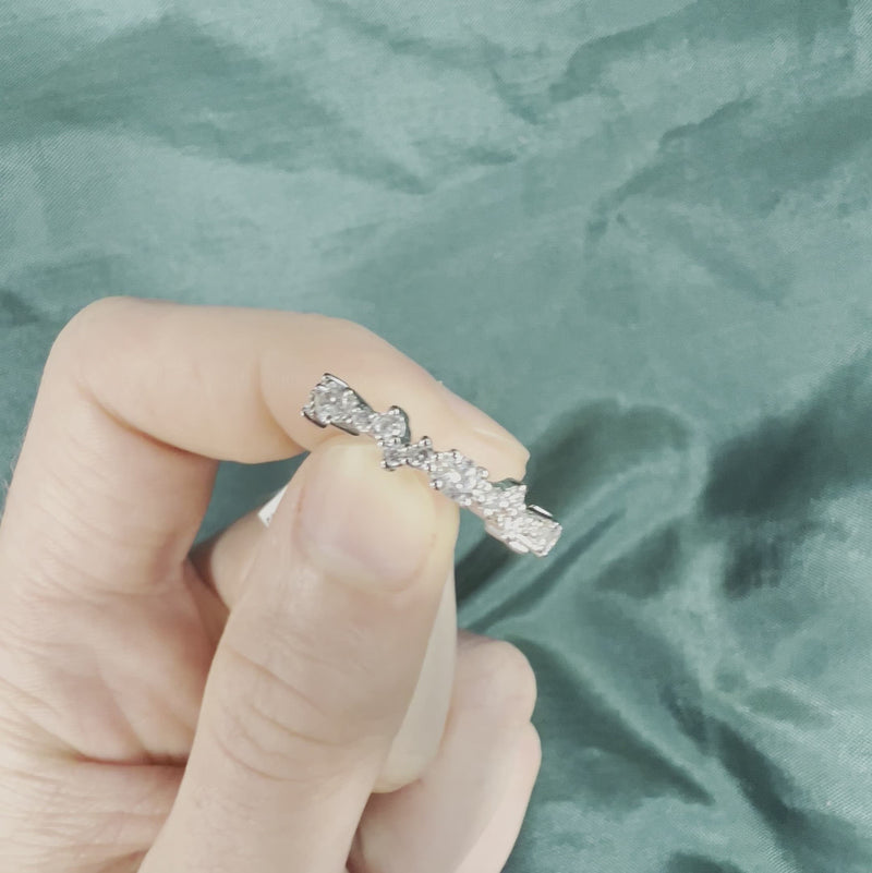 Hand holding diamond stackable anniversary band