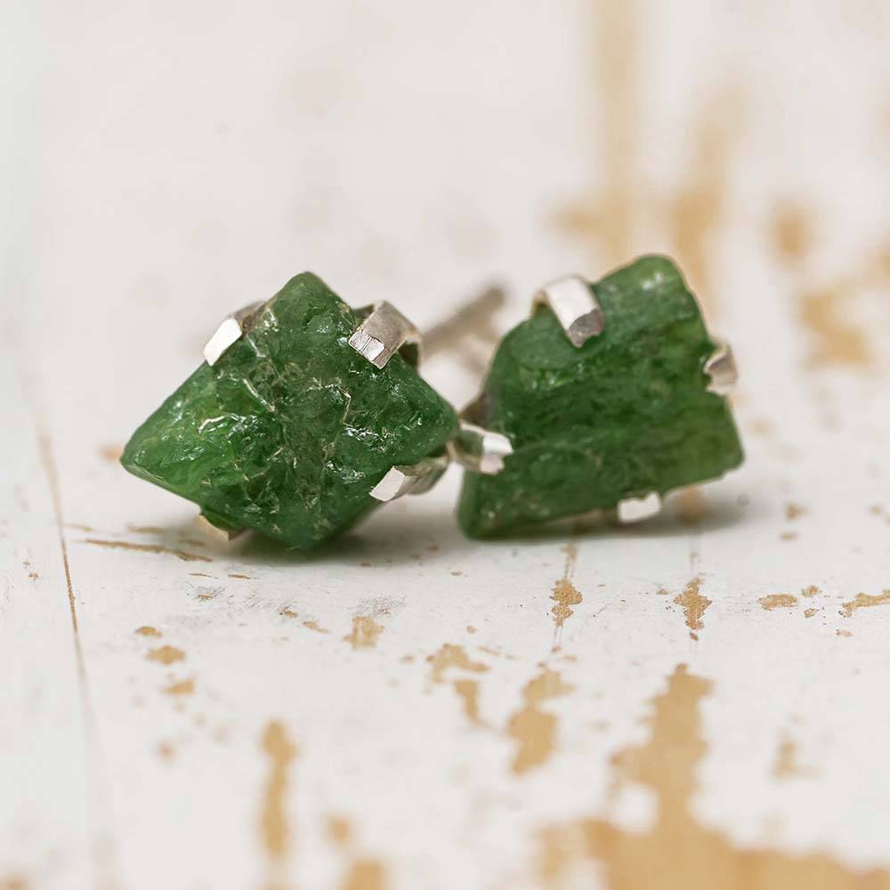 Emerald birthstone stud earrings in silver setting