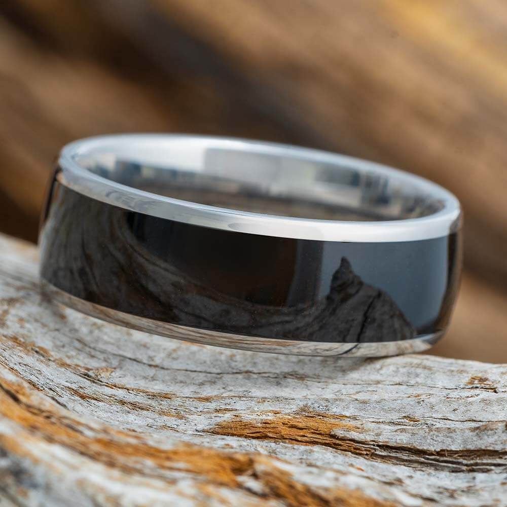 Black tungsten carbide ring deals with an ebony wood inlay