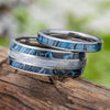 His & hers blue ring set with meteorite and mokume on wood