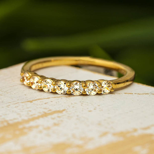 Yellow gold diamond anniversary band on display