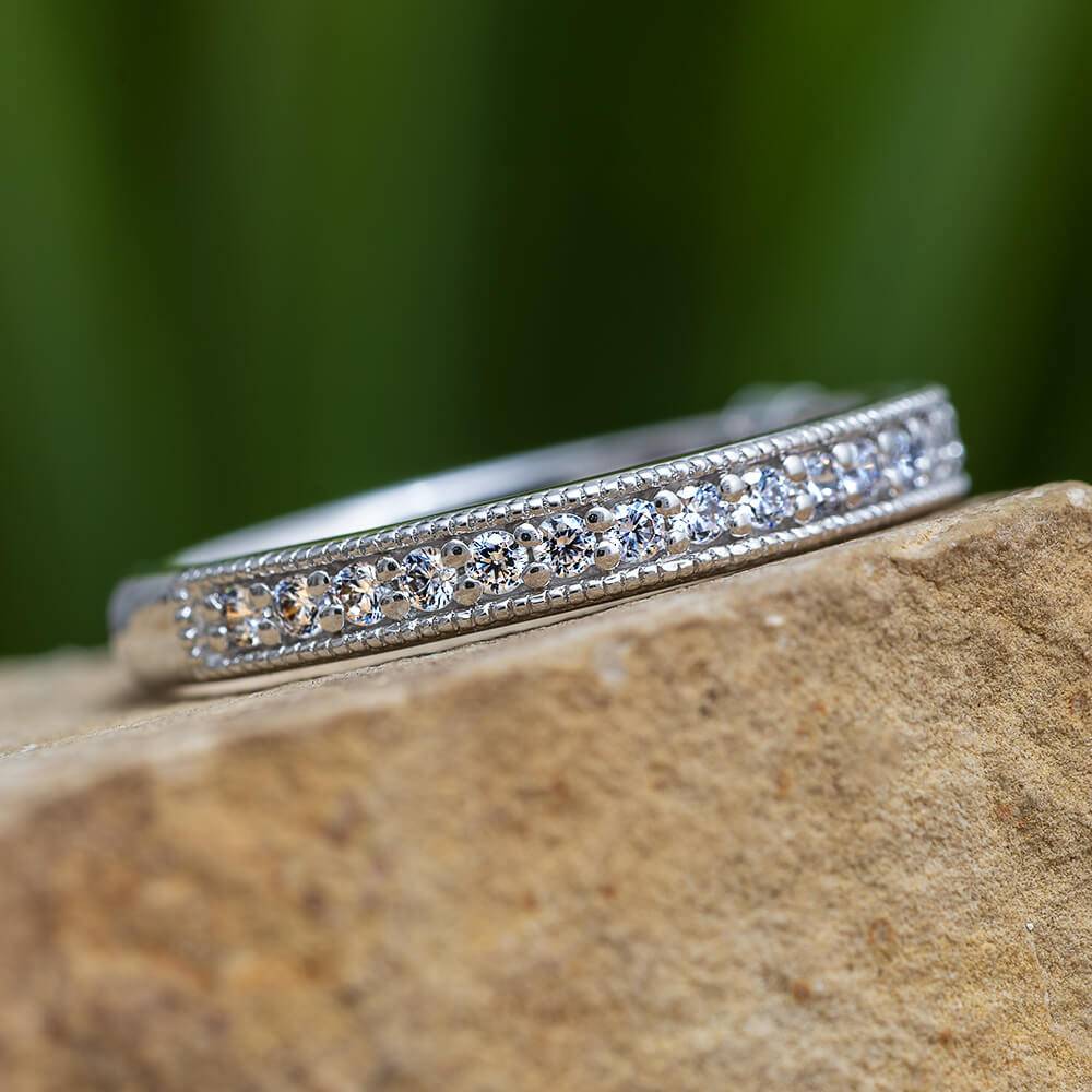 Diamond anniversary band with milgrain edges on stone