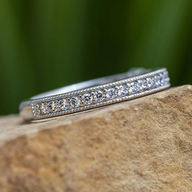 Diamond anniversary band with milgrain edges on stone
