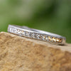 Diamond anniversary band with channel setting on stone