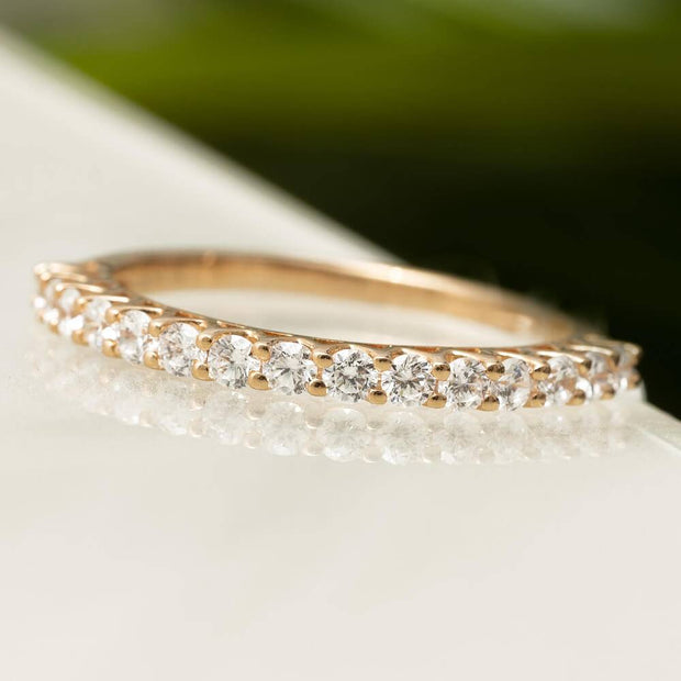 Rose gold diamond anniversary band with V-shaped prong setting