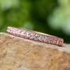 Rose gold diamond anniversary band on stone