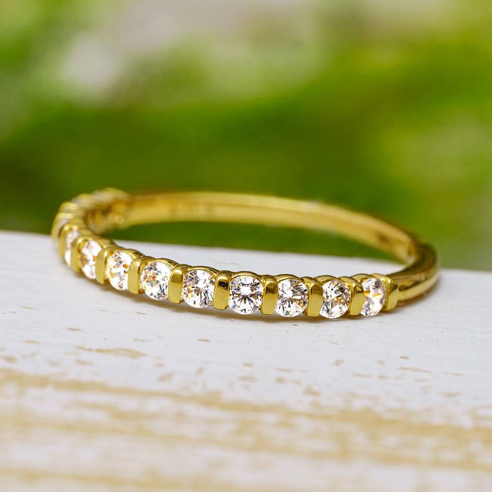 Yellow gold half eternity band with round cut diamonds