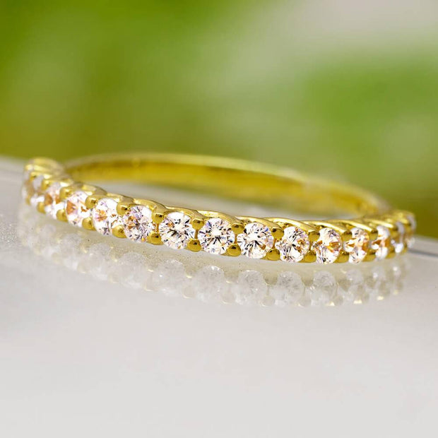 Yellow gold diamond wedding band with shared prong setting