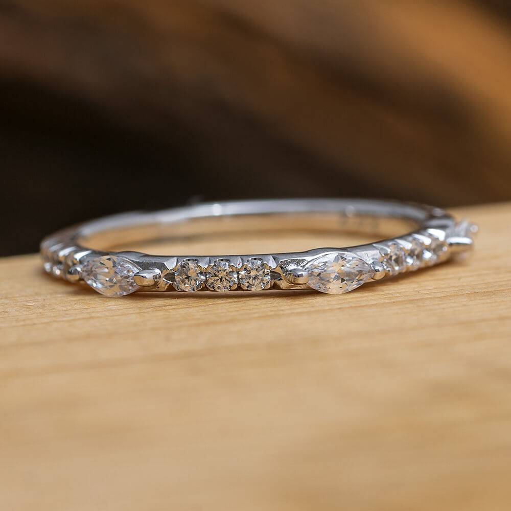 Marquise and round cut diamond half eternity band on wood
