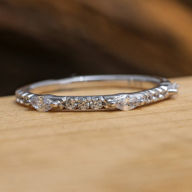 Marquise and round cut diamond half eternity band on wood