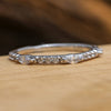 Marquise and round cut diamond half eternity band on wood