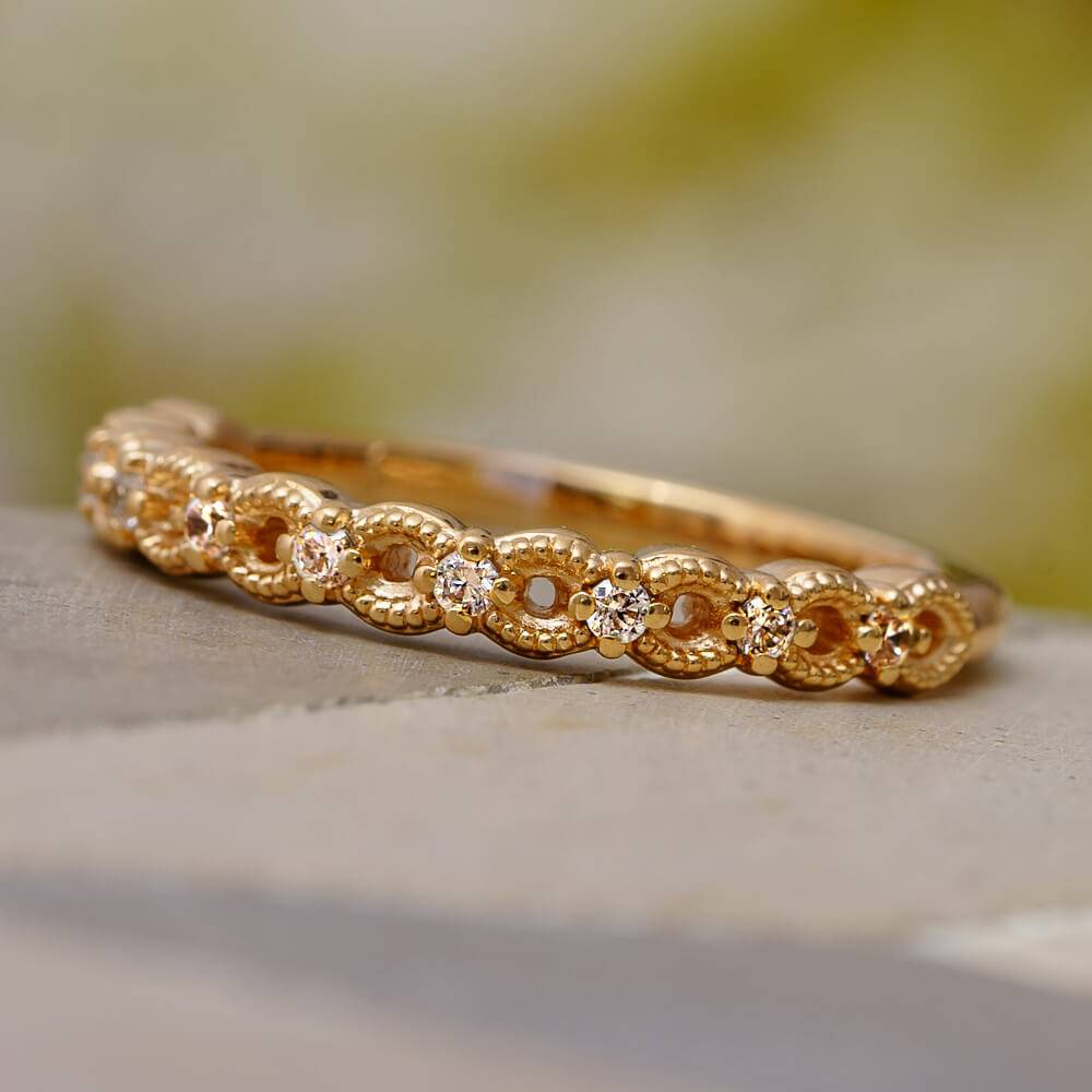 Rose gold anniversary band with diamonds and milgrain detail
