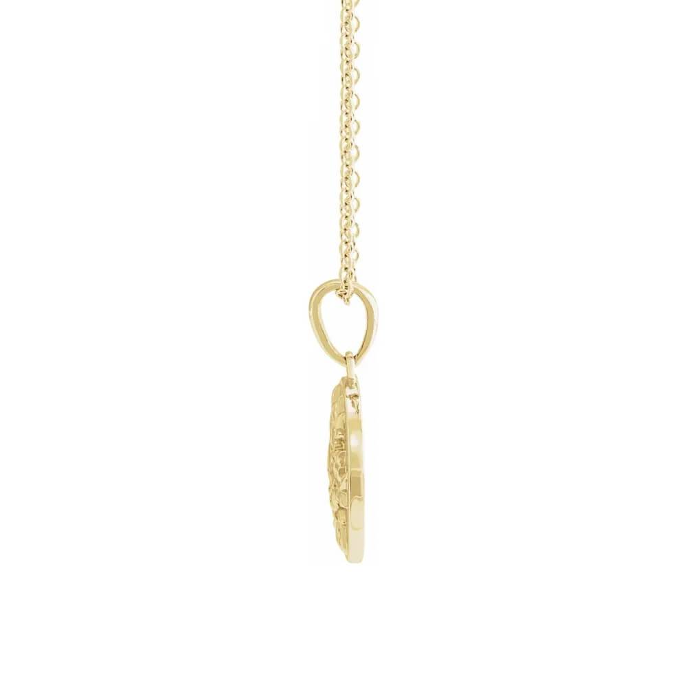 Side view of yellow gold circle necklace with floral design