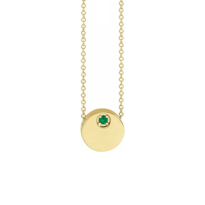 Gold circle necklace with emerald pendant