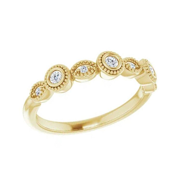 Yellow gold diamond band with bezel and pinpoint settings